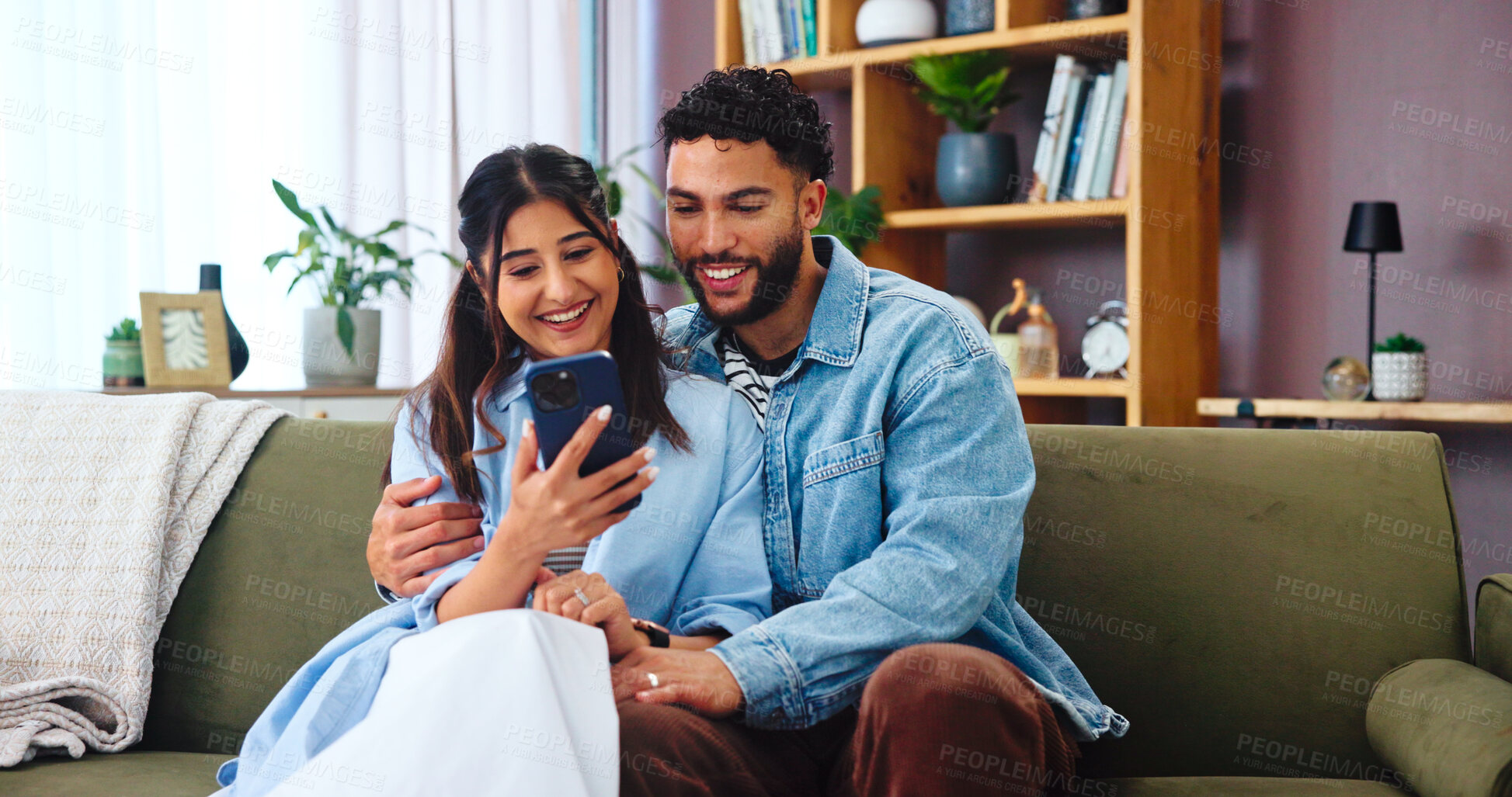 Buy stock photo Couple, phone and social media on sofa with hug, bonding and funny story in home. Woman, man and smartphone in living room for storytelling, comedy and celebrity news on timeline with internet gossip