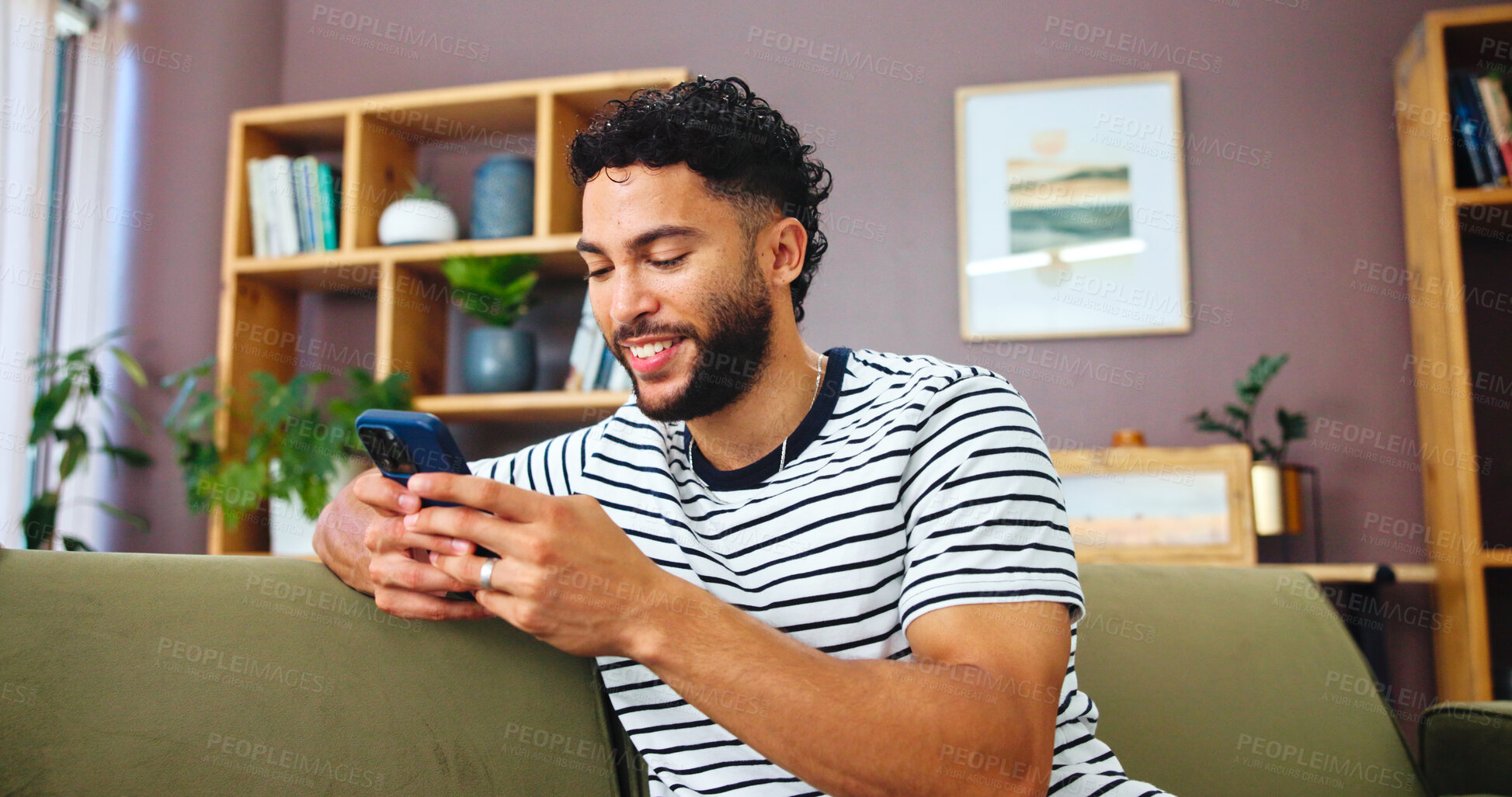 Buy stock photo Cellphone, networking and man on sofa in home with typing for social connection on mobile app. Happy, relax and male person with phone for texting on media with online dating in living room at house 