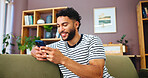 Cellphone, networking and man on sofa in home with typing for social connection on mobile app. Happy, relax and male person with phone for texting on media with online dating in living room at house 