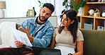 Documents, taxes and couple on sofa on laptop for bills, online payment and internet banking. Marriage, computer and man and woman with paperwork for financial planning, taxes and insurance budget