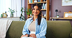 Portrait, woman and relax with smile on sofa for weekend break, comfortable and resting in living room. Wellness, person and happy in home for chill, calm and satisfaction with confidence or positive