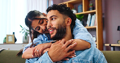Buy stock photo Home, hug and couple on sofa, love and bonding together with weekend break in lounge. Embrace, apartment and man with woman, calm and relax with romance, relationship and happiness with marriage