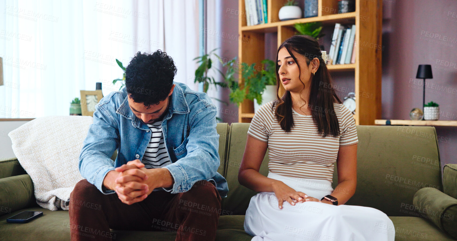 Buy stock photo Disappointed, conflict and couple in home, thinking and betrayal for man in relationship, hurt and lounge. Contemplating, pain and woman with regret for cheating, divorce and heartbreak for people