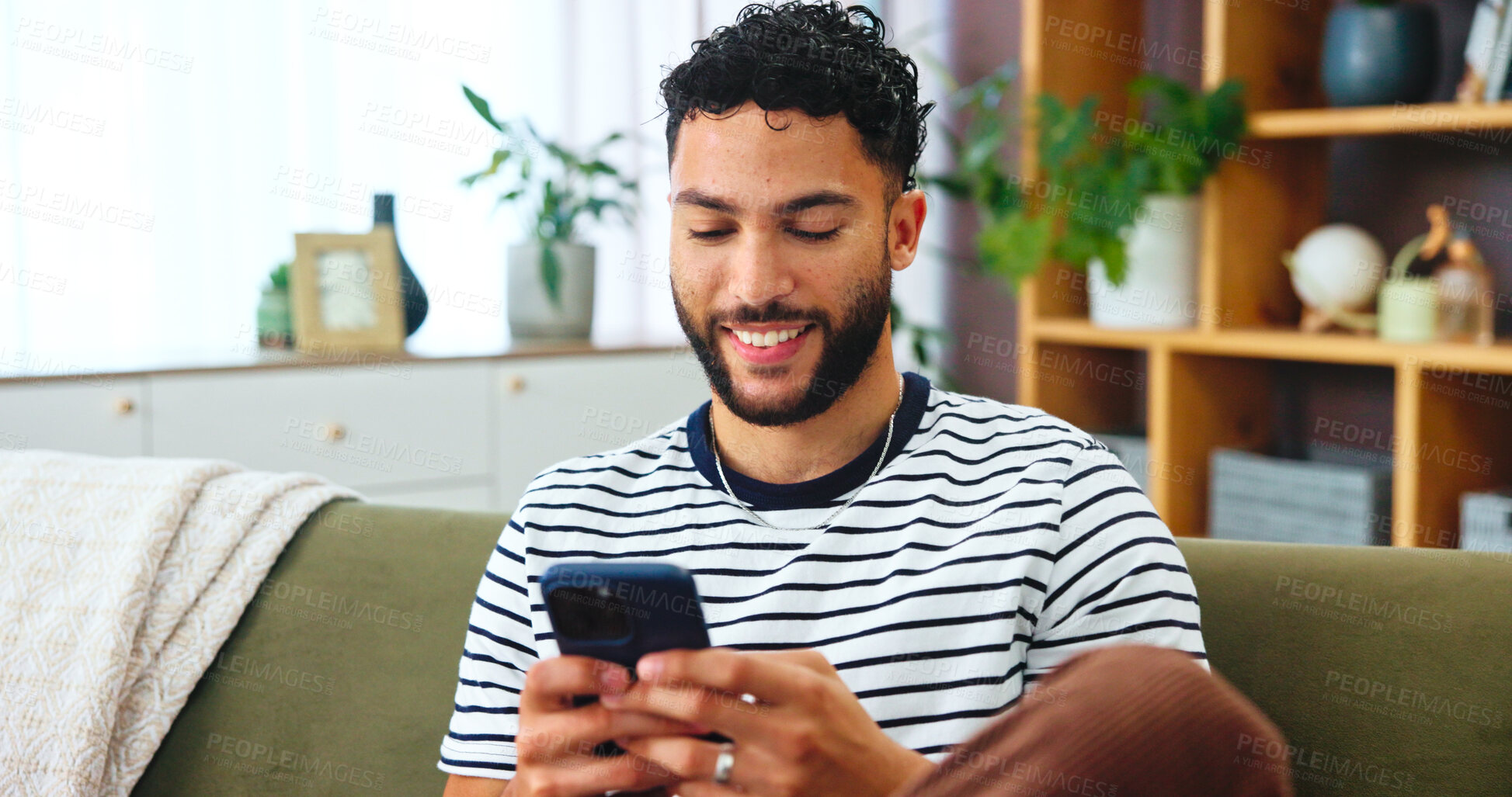 Buy stock photo Phone, networking and man on sofa in house with typing for social connection on mobile app. Happy, relax and male person with cellphone for texting on media with online dating in living room at home 