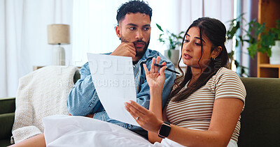 Buy stock photo Couple, document and budget planning in home, mortgage expenses or insurance application. Living room, man and woman with paper for financial discussion, taxes or bills for asset management with debt