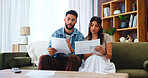 Documents, taxes and couple on sofa for bills, payment receipts and banking in home. Marriage, relationship and man and woman with paperwork for financial planning with mortgage, insurance and budget