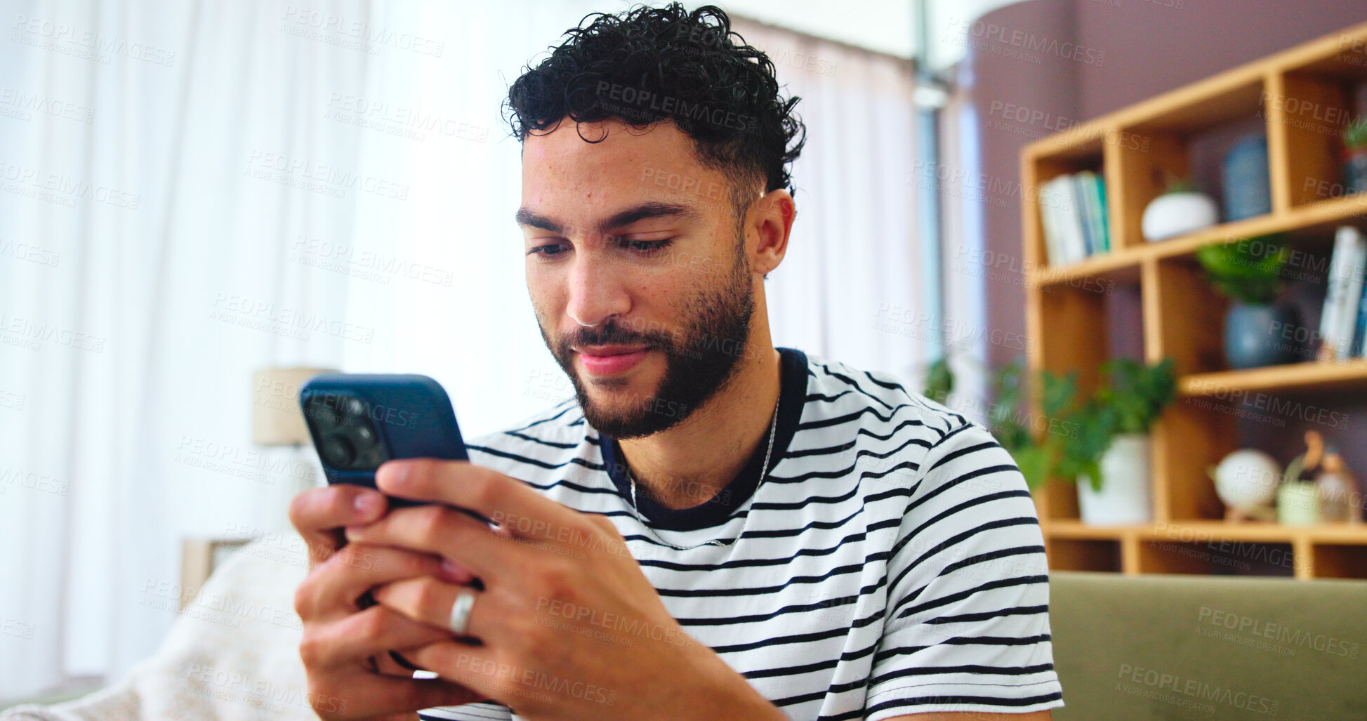 Buy stock photo Smartphone, networking and man on sofa in home with typing for social connection on mobile app. Happy, relax and male person with phone for texting on media with online dating in living room at house