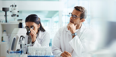Buy stock photo Scientist, woman and man with microscope for chemistry, testing and medical research. Biotech, laboratory and assistant with mentor for pharmaceutical or pathology experiment for health breakthrough
