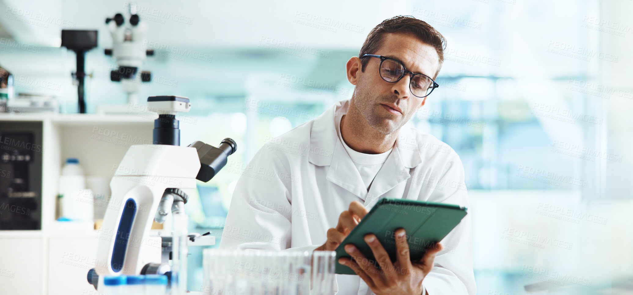 Buy stock photo Scientist, man and tablet with typing in lab for medical research by container, review or vaccine development. Person, touchscreen and chemical analysis with pharmaceutical drugs on app by microscope