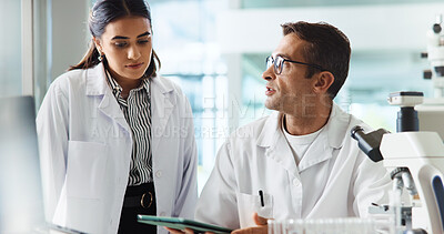 Buy stock photo Scientist, woman and man with tablet for chemistry, testing and medical research. Biotech, laboratory and assistant with teamwork for pharmaceutical or pathology experiment for health breakthrough