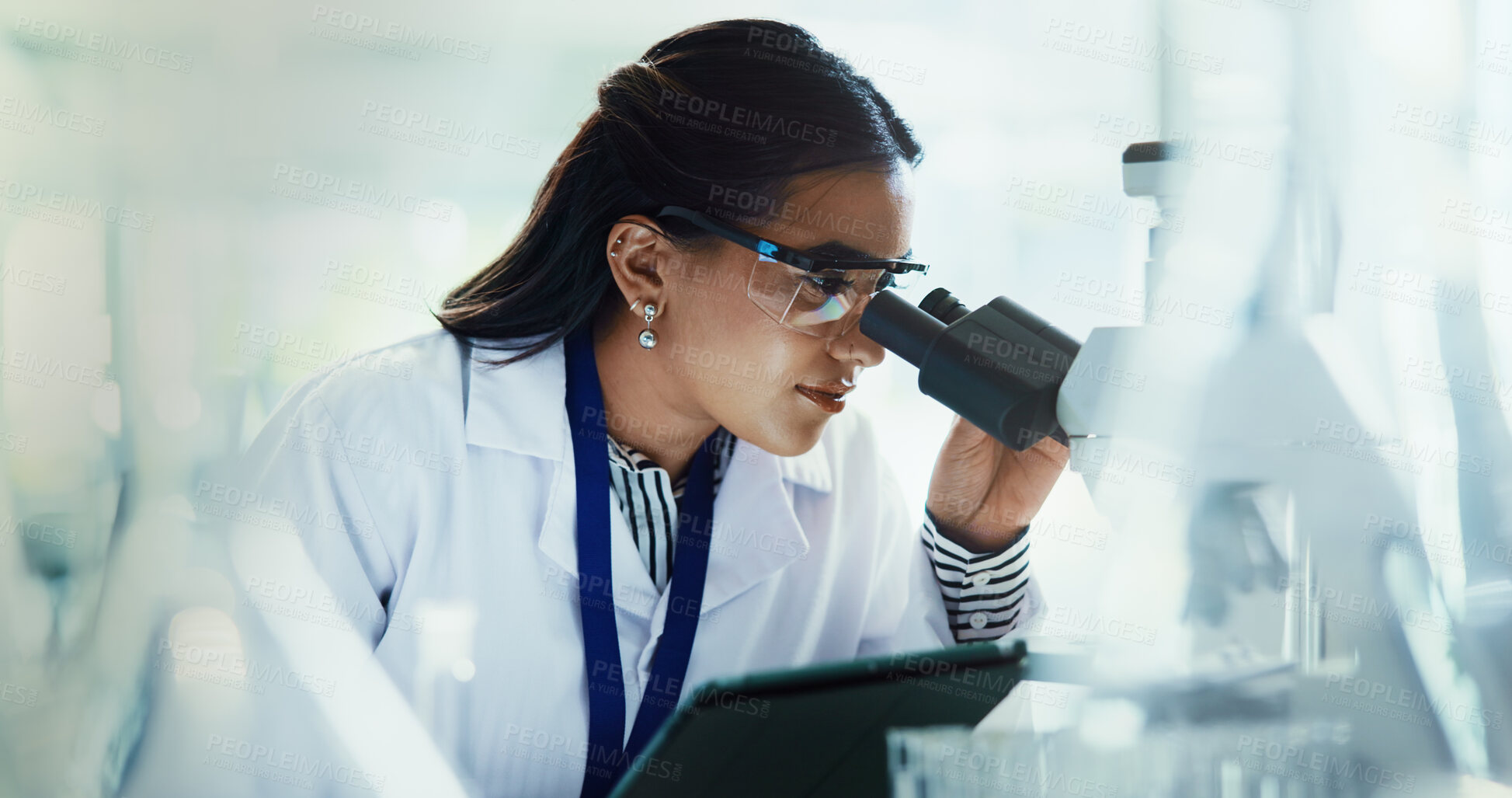 Buy stock photo Scientist, woman and tablet with microscope for pathology, testing and medical research. Biotech, laboratory and analysis with data inspection for pharmaceutical or chemistry experiment checklist