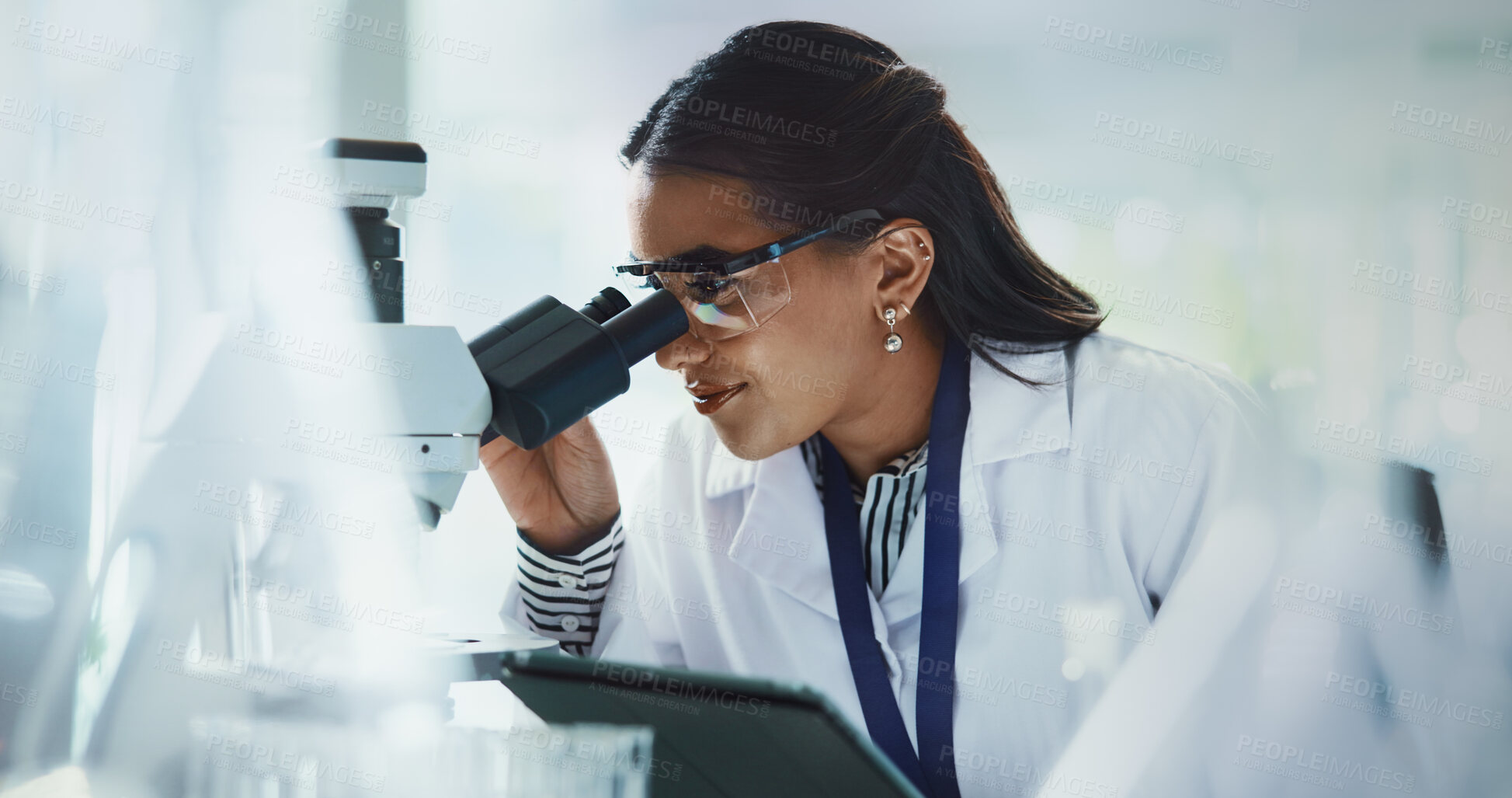 Buy stock photo Scientist, woman and tablet with microscope for biotech, testing and medical research. Pathology, laboratory and analysis with data inspection for pharmaceutical or chemistry experiment checklist