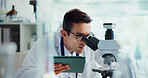 Research, tablet or man in lab with microscope, vaccine test or medical experiment for cancer treatment. Biotech, check or scientist with science, study or sample with cure, particles or bacteria