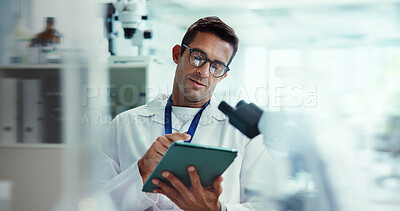 Buy stock photo Scientist, man and tablet with research in lab for medical study by container, review or vaccine development. Person, touchscreen and chemical analysis with pharmaceutical test on app by microscope
