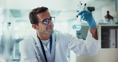 Buy stock photo Scientist, man and smile with test tube in lab, review and chemical reaction for medicine development. Person, glass container and liquid for pharmaceutical, study and medical research for vaccine