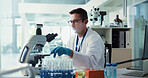Scientist, man and sample by microscope in lab for medical research with container, test or vaccine development. Person, process and chemical analysis with pharma trial, drugs and petri dish by lens