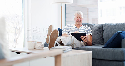 Buy stock photo Sofa, senior man and relax with tablet for online game, web surfing and reading ebook at home. House, elderly person and chill on couch with digital poker, social media and connection in retirement