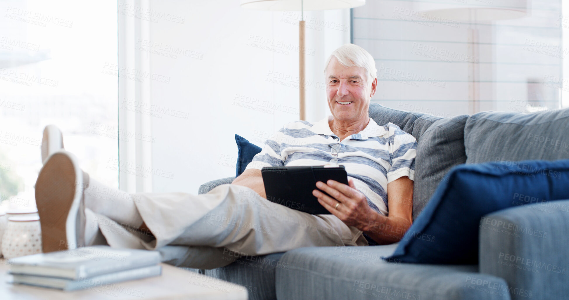 Buy stock photo Sofa, senior man and portrait with tablet for online game, web surfing and reading ebook at home. House, elderly person and relax on couch with digital poker, social media or connection in retirement