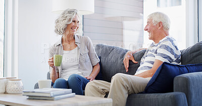 Buy stock photo Bonding, conversation and senior couple with coffee, smile and romance for relationship in living room. House, old man and woman with tea, retirement and elderly people in lounge, talking or marriage