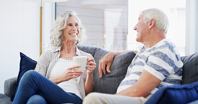 Buy stock photo Home, smile and senior couple with coffee, conversation and romance for relationship in living room. Bonding, old man and woman with tea, retirement and elderly people in lounge, talking or marriage