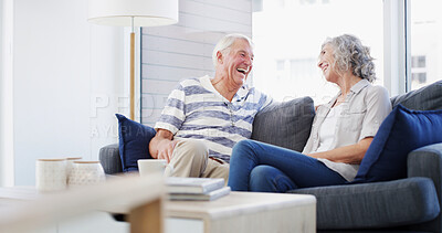 Buy stock photo Laughing, senior couple and conversation in home, smile and romance for relationship in living room. House, old man and woman in retirement, comfortable and elderly people in lounge, calm or marriage