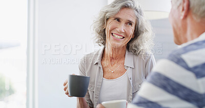 Buy stock photo Happy, relax and senior couple with coffee, home and romance for relationship in living room. Bonding, old man and woman with tea, retirement and elderly people in lounge, conversation or marriage