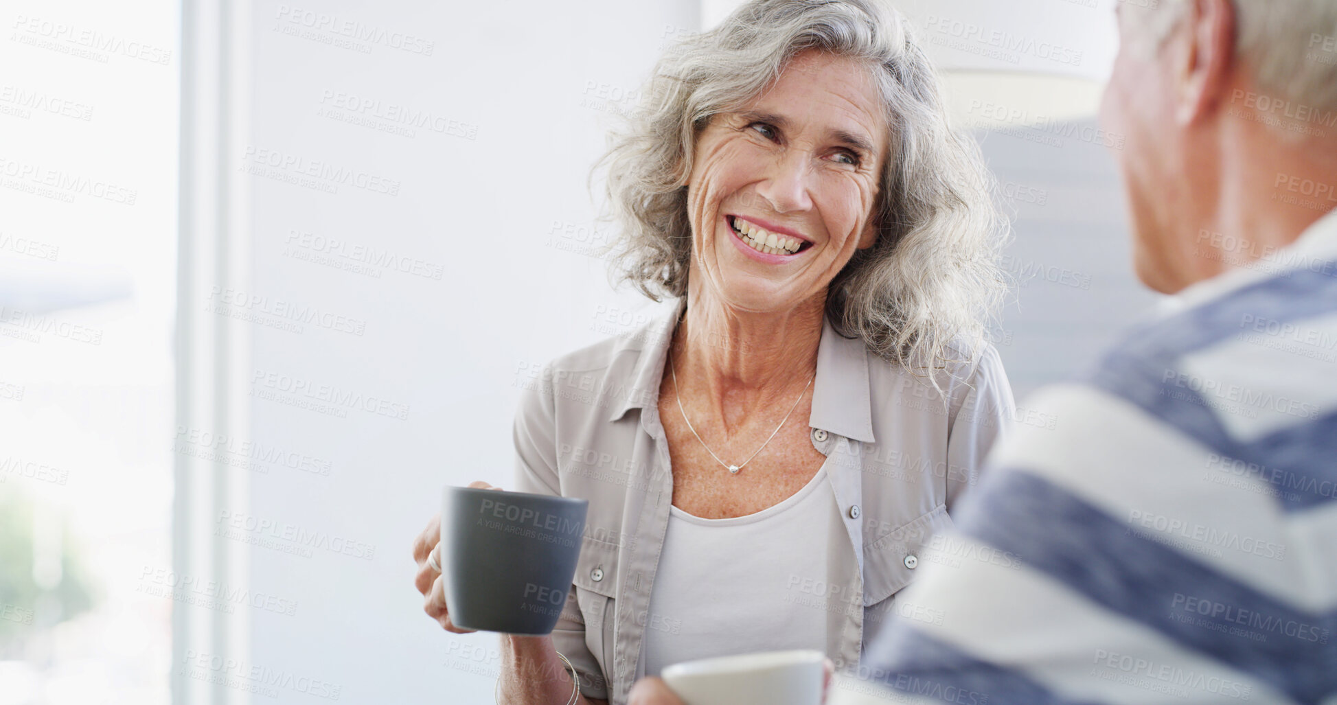 Buy stock photo Happy, relax and senior couple with coffee, home and romance for relationship in living room. Bonding, old man and woman with tea, retirement and elderly people in lounge, conversation or marriage