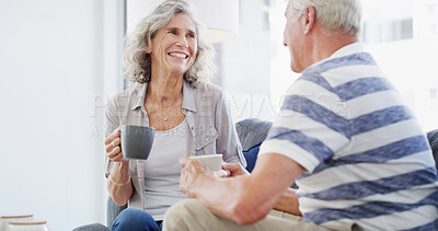 Buy stock photo Bonding, relax and senior couple with coffee, home and romance for relationship in living room. Happy, old man and woman with tea, retirement and elderly people in lounge, conversation or marriage