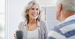 Home, talking and senior couple with coffee, happy and romance for relationship in living room. Bonding, old man and woman with tea, retirement and elderly people in lounge, conversation or marriage