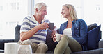 Senior father, daughter and talk on couch, happy or relax with coffee, love or reunion in living room at nursing home. Elderly man, woman and laugh with dad, drinks or retirement for memory in lounge