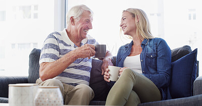 Buy stock photo Senior father, daughter and talk on couch, happy or relax with coffee, love or reunion in living room at nursing home. Elderly man, woman and laugh with dad, drinks or retirement for memory in lounge