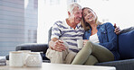 Senior father, daughter and hug on sofa, happy and relax with coffee, love and reunion in living room at nursing home. People, family and embrace with man, woman and retirement with memory on couch