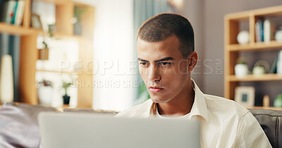 Buy stock photo Reading, student and man on sofa with laptop for online research, studying and elearning for college. Remote work, school and person on computer for project, assignment and education for university