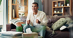 Man, watching tv and happy on sofa, excited or ready for cheers, goal or sport in living room at apartment. Person, smile and streaming subscription for contest, competition and tournament in home