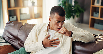 Buy stock photo Man, cough and sick with chest pain on sofa, asthma and infection virus in living room at home. House, male person and respiratory illness on couch for pneumonia, tuberculosis and bacteria with flu