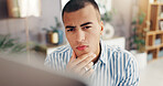 Man, thinking and home with computer for decision, choice or planning creative solution. Face, male person or thoughtful freelancer in remote work with technology for software update or schedule