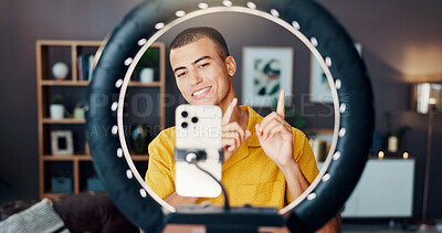 Buy stock photo Man, influencer and phone with ring light in home for live streaming, video or smile on social network. Person, recording and point with review for chat, audience and mobile app for content creation