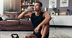 Man, exercise and tired on floor, drinking water and bottle and home with fitness, health or burnout in lounge. Person, break and exhausted with workout, training or liquid for hydration at apartment