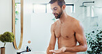 Man, lotion and skincare with mirror in bathroom for hygiene, anti aging or grooming at home. Male person, product or face cream with SPF for facial treatment, skin protection or dermatology at house