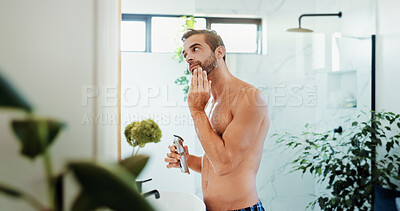 Buy stock photo Man, razor and shave with beard in bathroom for grooming, skincare hygiene or clean face at home. Male person, topless or facial treatment with hair removal or electric machine for morning epilation