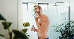 Man, razor and shave with reflection in bathroom for grooming, skincare hygiene or clean face at home. Male person, facial treatment and hair removal with electric machine for morning epilation