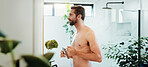 Home, razor and man in bathroom, shaving and shirtless with facial grooming routine, morning and hygiene. Person, apartment and guy with cosmetic tools, skincare and health with beauty and aesthetic