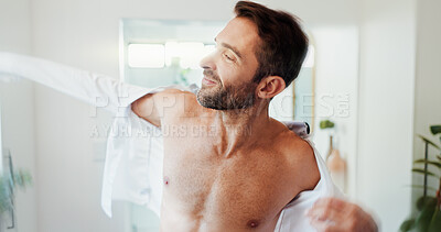Buy stock photo Smile, clothes and ready with man in bathroom for dressing, morning routine and grooming. Cleaning, corporate fashion and style with person and shirt at home for start, professional and confidence