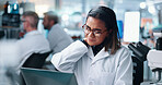 Scientist, woman and neck pain with ache in laboratory for medical research by laptop, burnout and frustrated. Person, computer and DNA study with stress, tired and exhausted with pharmaceutical job