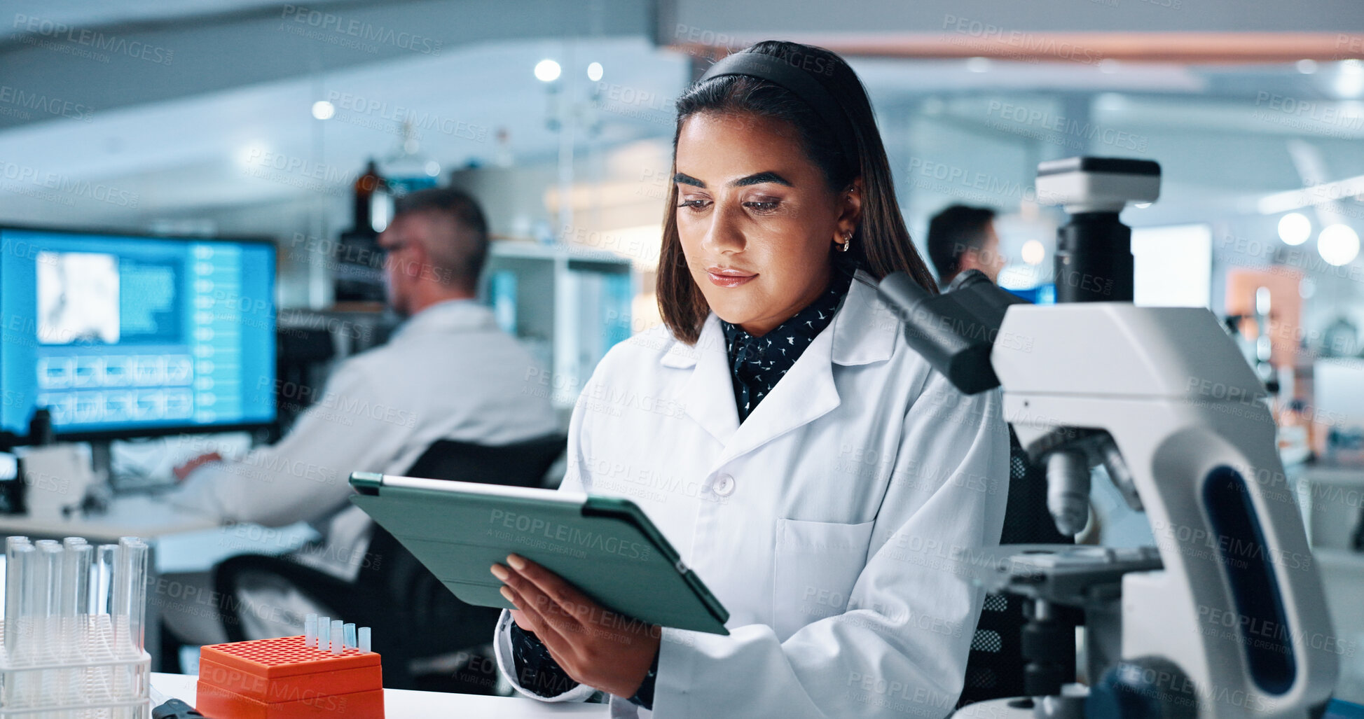 Buy stock photo Healthcare, tablet and reading with woman in laboratory for DNA discovery, science or research. Gene study, medical and clinical trial with scientist in clinic for microscope, results and biotech