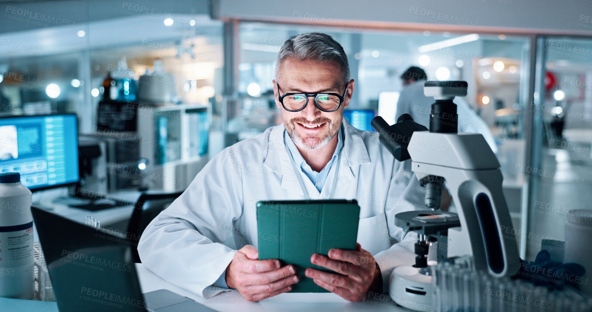 Buy stock photo Science, smile and tablet with man in laboratory for research results, healthcare and report on study. Medical development, innovation and microscope with mature person for pharmacy and experiment