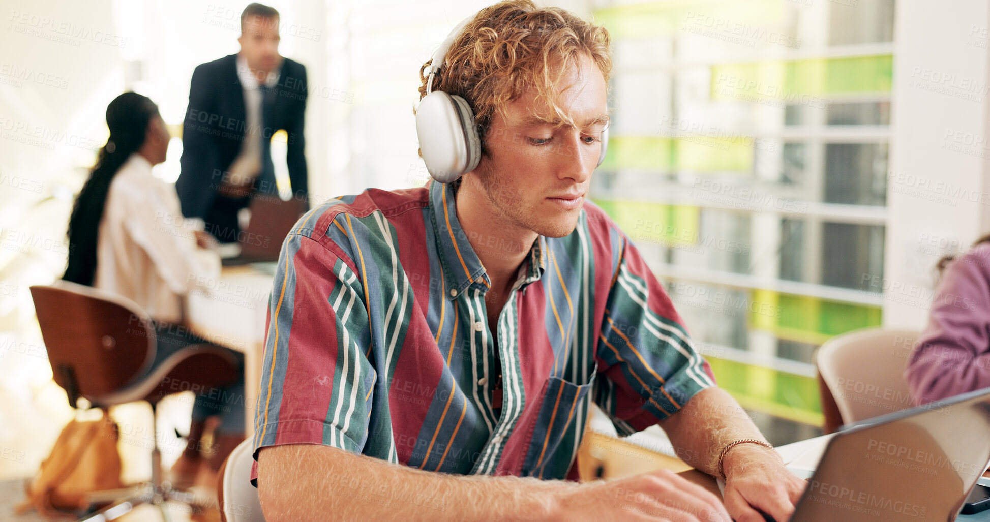 Buy stock photo College student, man and laptop with typing, headphones or education with notes, test or exam in study hall. Person, streaming and project for elearning, music or prepare for assessment at university