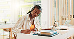 Writing, student and woman with laptop, headphones and exam in classroom with info, online and reading. Learning, scholarship and black person in college with tech, education or serious for knowledge
