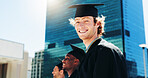 Building, graduation and portrait of man student outdoor for celebration or education event. City, future and scholarship with happy college or university graduate in urban town for milestone