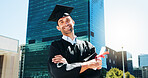 Portrait, outdoor and man with graduation, arms crossed and smile with diploma, urban town or success. Face, happy person or student with achievement, university or scholarship with certificate award